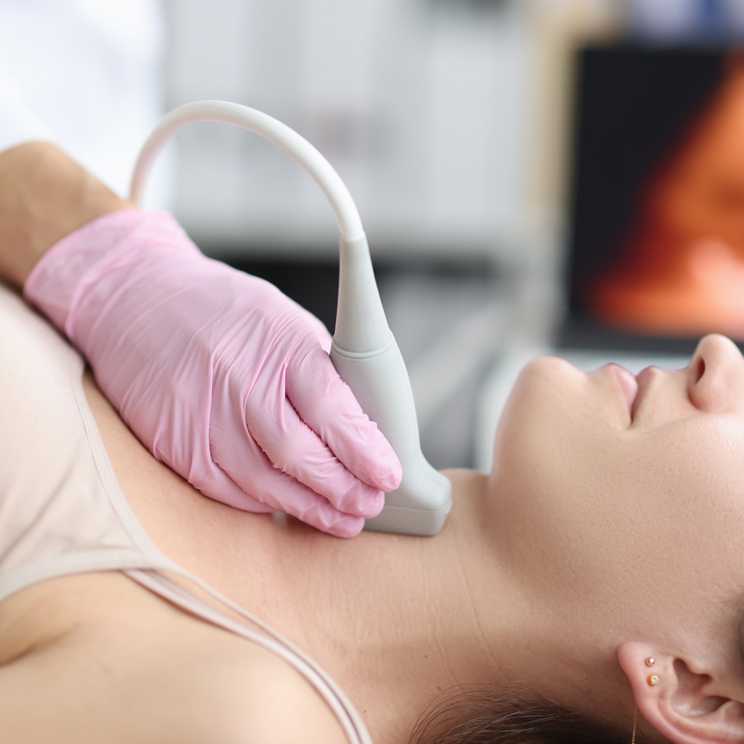 Woman getting an ultrasound of her neck